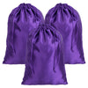 A set of three purple satin drawstring storage pouches.