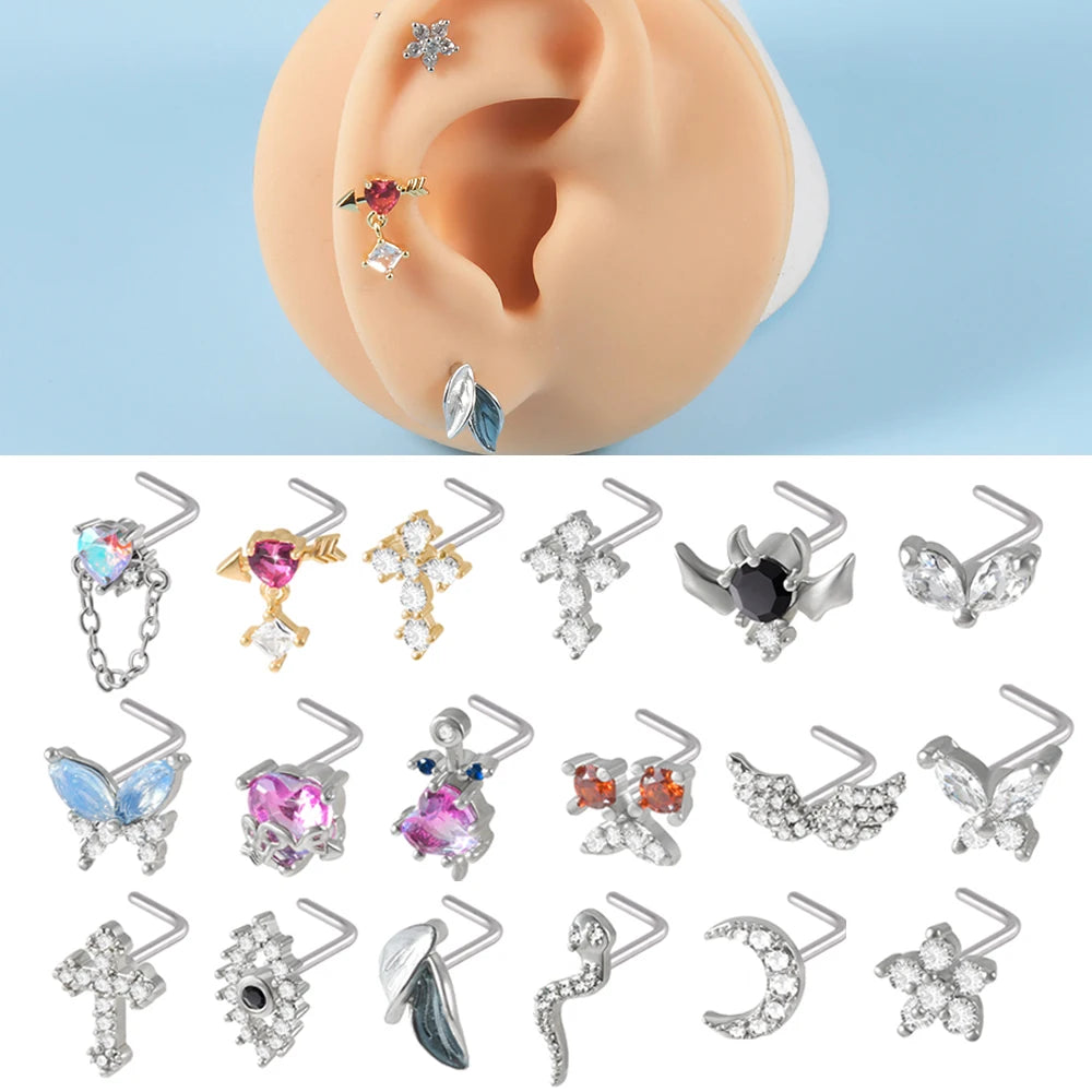 A collection of surgical steel demon angel nose studs in various designs and materials.