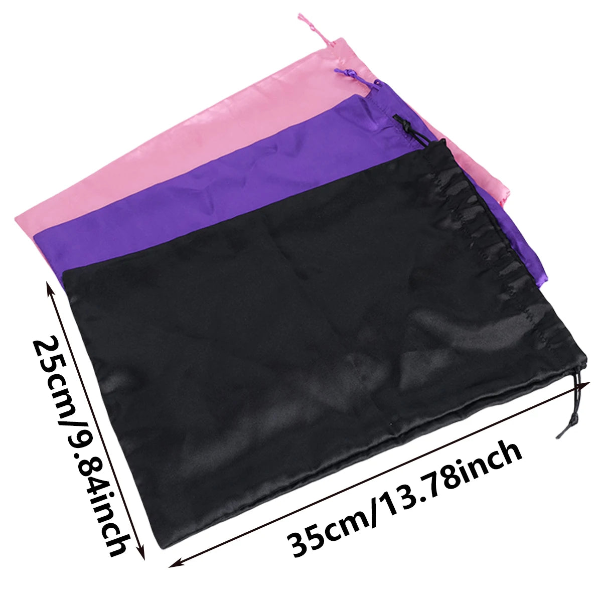 Set of three satin drawstring storage pouches in pink, purple, and black.