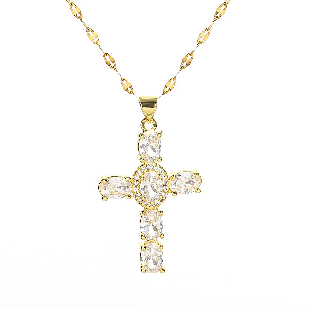 A gold-toned stainless steel cross necklace featuring clear, brilliant-cut gemstones.