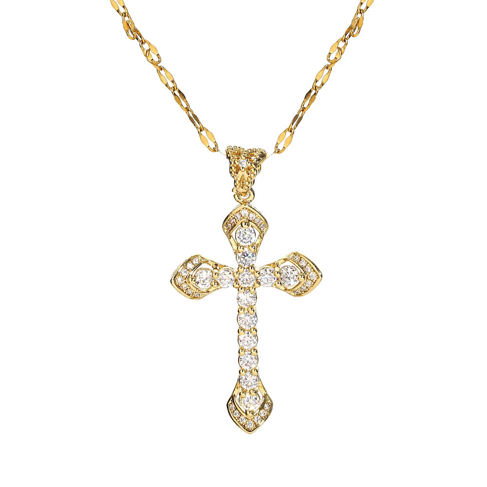 A gold stainless steel cross necklace with a detailed design and small diamonds.