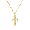 A gold-toned stainless steel cross necklace with a delicate chain and small pave diamonds.