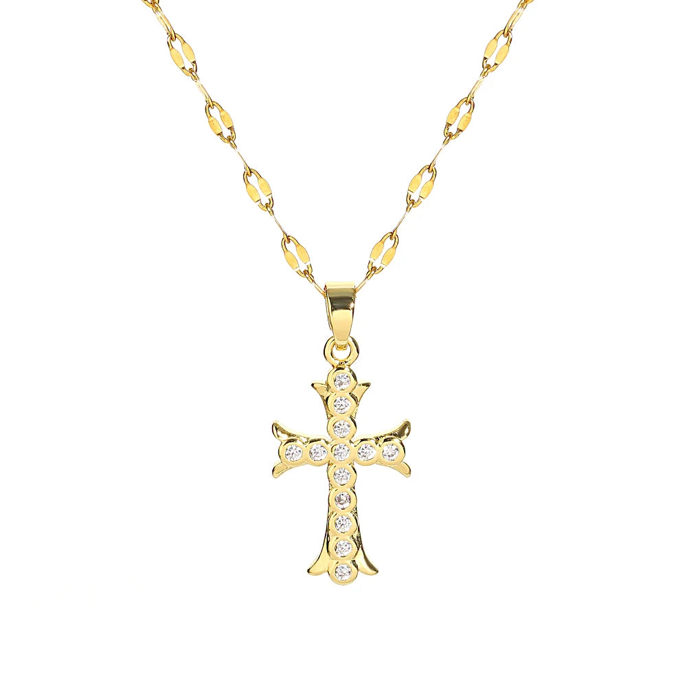 A gold-toned stainless steel cross necklace with a delicate chain and small pave diamonds.
