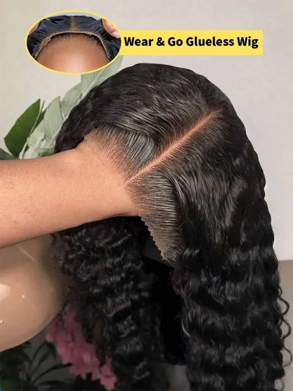 A close-up of a long, dark curly wig being worn on a person's head, demonstrating the seamless glueless application.