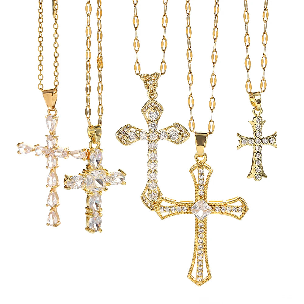 A set of gold-toned stainless steel cross necklaces with various designs and chain lengths.