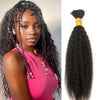 A woman modeling black kinky straight human hair extensions styled in a high ponytail.