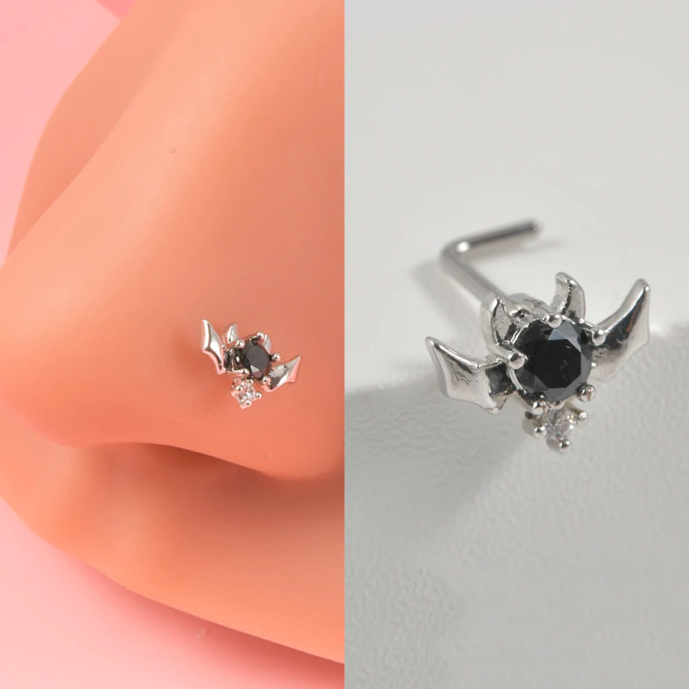 Silver surgical steel demon angel nose studs with black gemstone detail