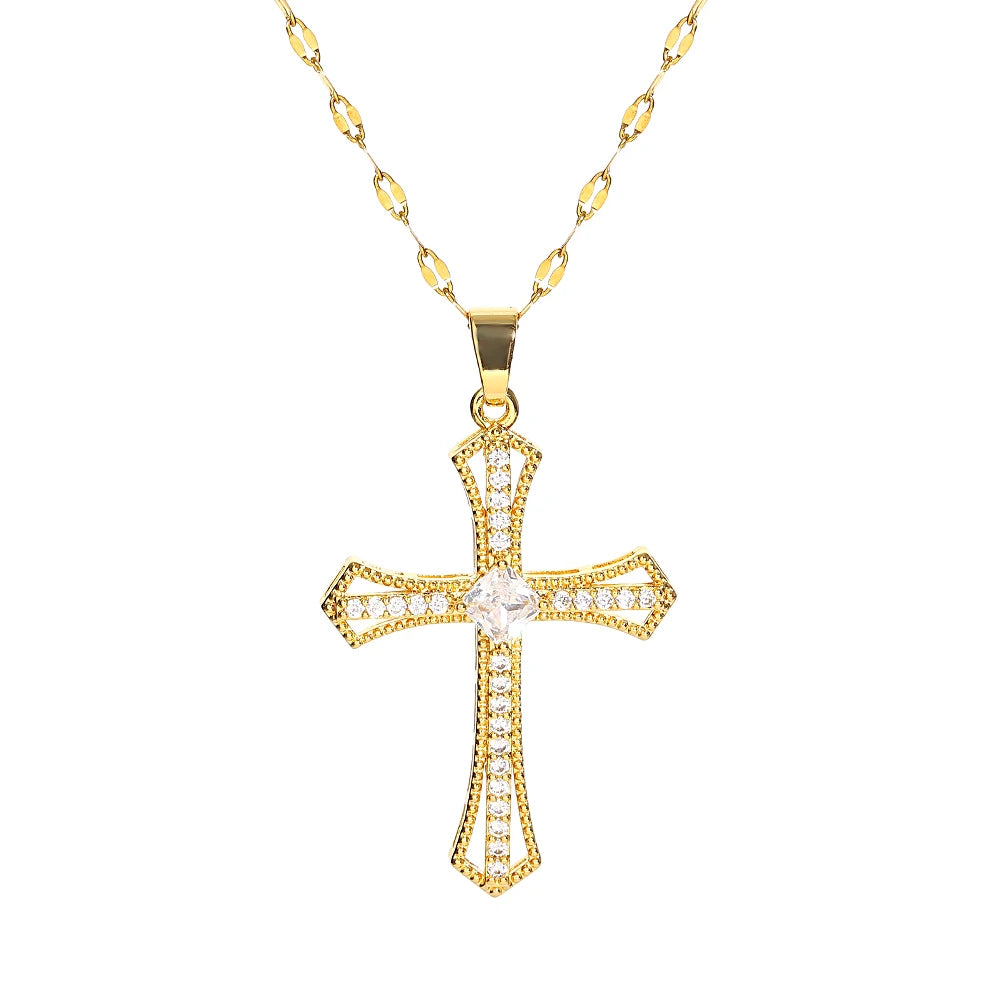 A gold-toned stainless steel cross necklace with a detailed design and chain.