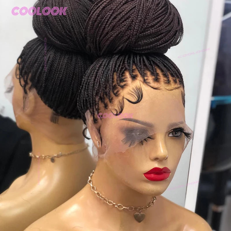 A close-up of a model wearing a black cornrow braids full lace wig styled in a high bun with dramatic eye makeup.