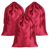 A set of three deep red satin drawstring storage pouches.