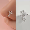 Silver surgical steel demon angel nose studs with a floral design