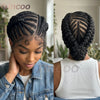 Close-up of a woman with short cornrow braided hair styled into an updo