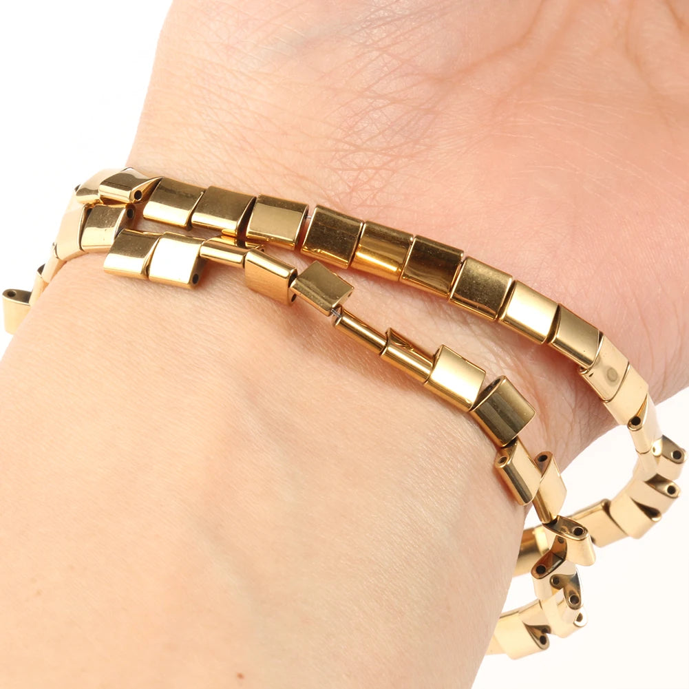Gold-plated hematite round cube beads strung on a bracelet for DIY jewelry