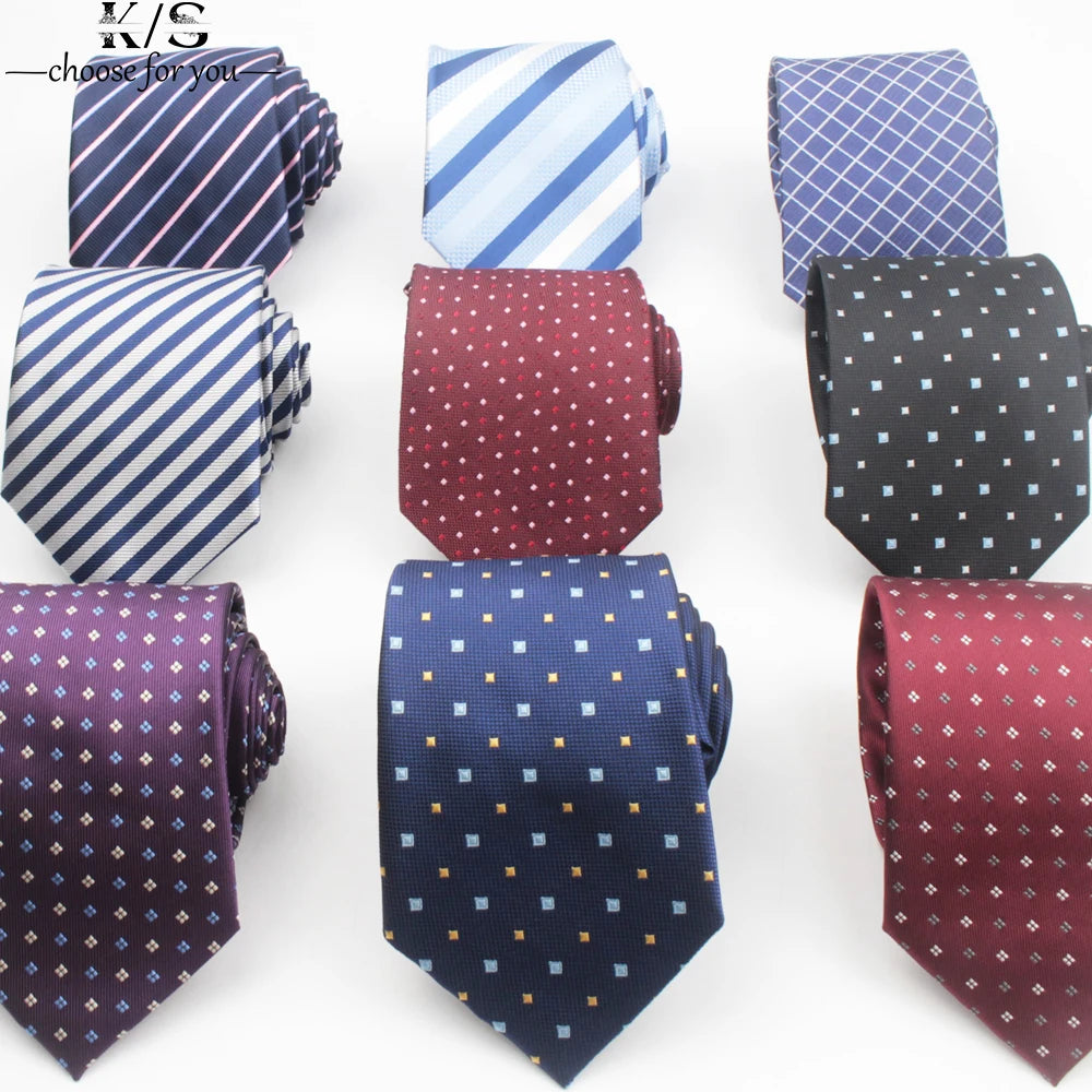 A collection of men's neckties featuring various patterns including stripes, dots, and solids in blue, purple, and black.