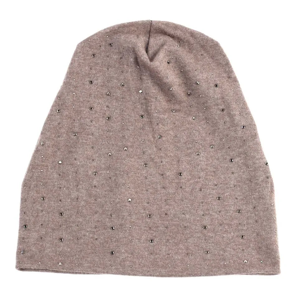 A dusty rose colored beanie hat adorned with small silver rhinestones.