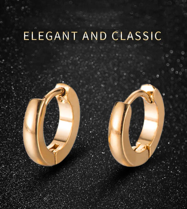 Pair of elegant gold hoop earrings displayed against a dark, sparkling background.