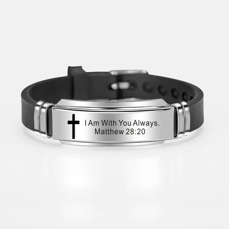 A black leather bracelet with a silver plate engraved with the scripture Matthew 28:20 I am with you always.