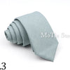 A light blue solid color anti-wrinkle bamboo fiber tie folded neatly.
