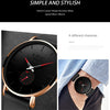 A black LIGE men's watch with a rose gold case and black strap shown on a wrist.