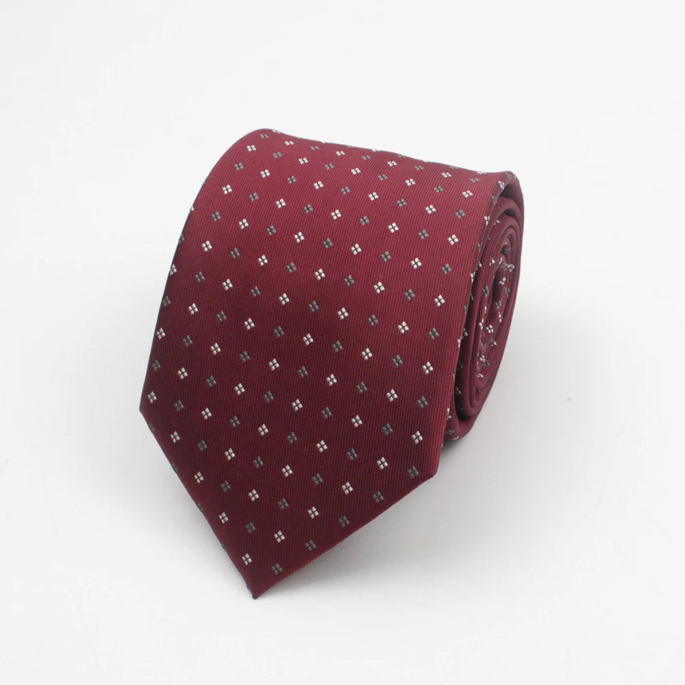 A maroon necktie with a subtle pattern of small silver dots on a white background.
