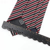 A close-up of a classic men's tie featuring a striped pattern with plaid dots and a black measuring tape.
