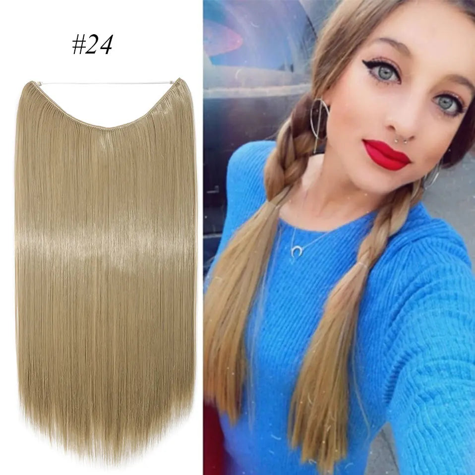 A woman shows off long, straight blonde hair extensions styled in a braid against a blue background.