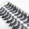 A close-up of a tray of dramatic mink false eyelashes with long, voluminous lashes.