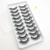 A white tray filled with a set of dramatic mink false eyelashes for eye makeup.