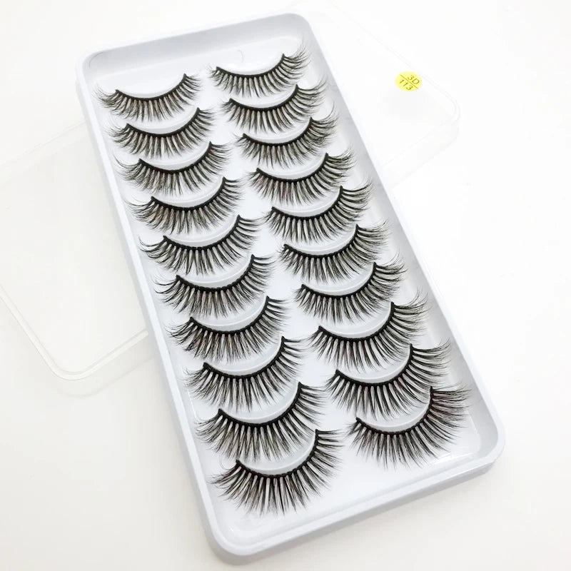 A white tray filled with a set of dramatic mink false eyelashes for eye makeup.