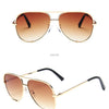 Gold frame sunglasses with tea lens in a classic aviator style, shown in a positive view.