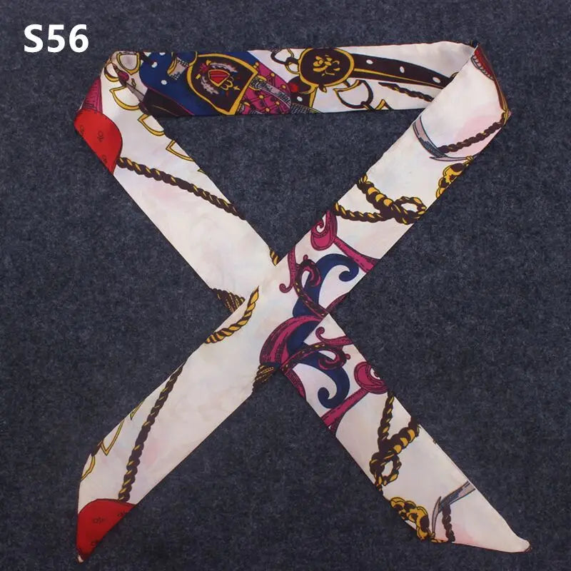 A multi-color leopard print silk headband scarf tied in an 'X' shape.
