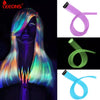 A collection of synthetic hair extensions in various rainbow colors, including purple, green, and blue shades.