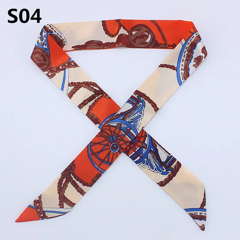 Orange and white silk headband scarf with a leopard print design folded into an 'X' shape