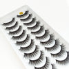 A display of dramatic mink false eyelashes on a white tray.