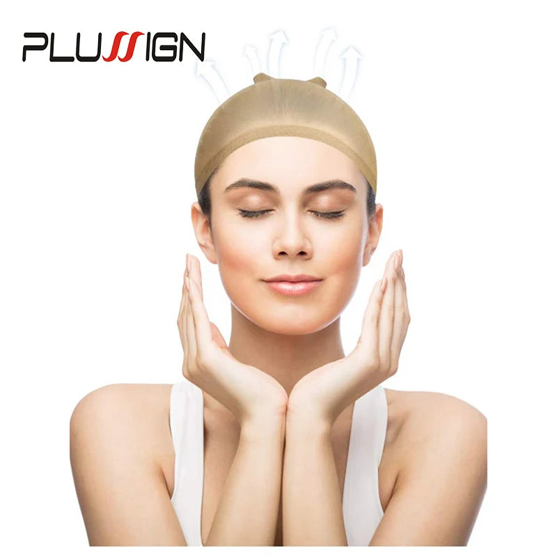 A woman is shown wearing a beige stretchable nylon wig cap on her head.