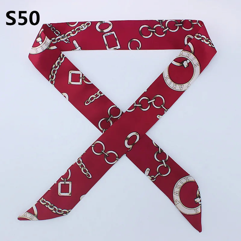 A red silk scarf with a chain pattern in a cross design