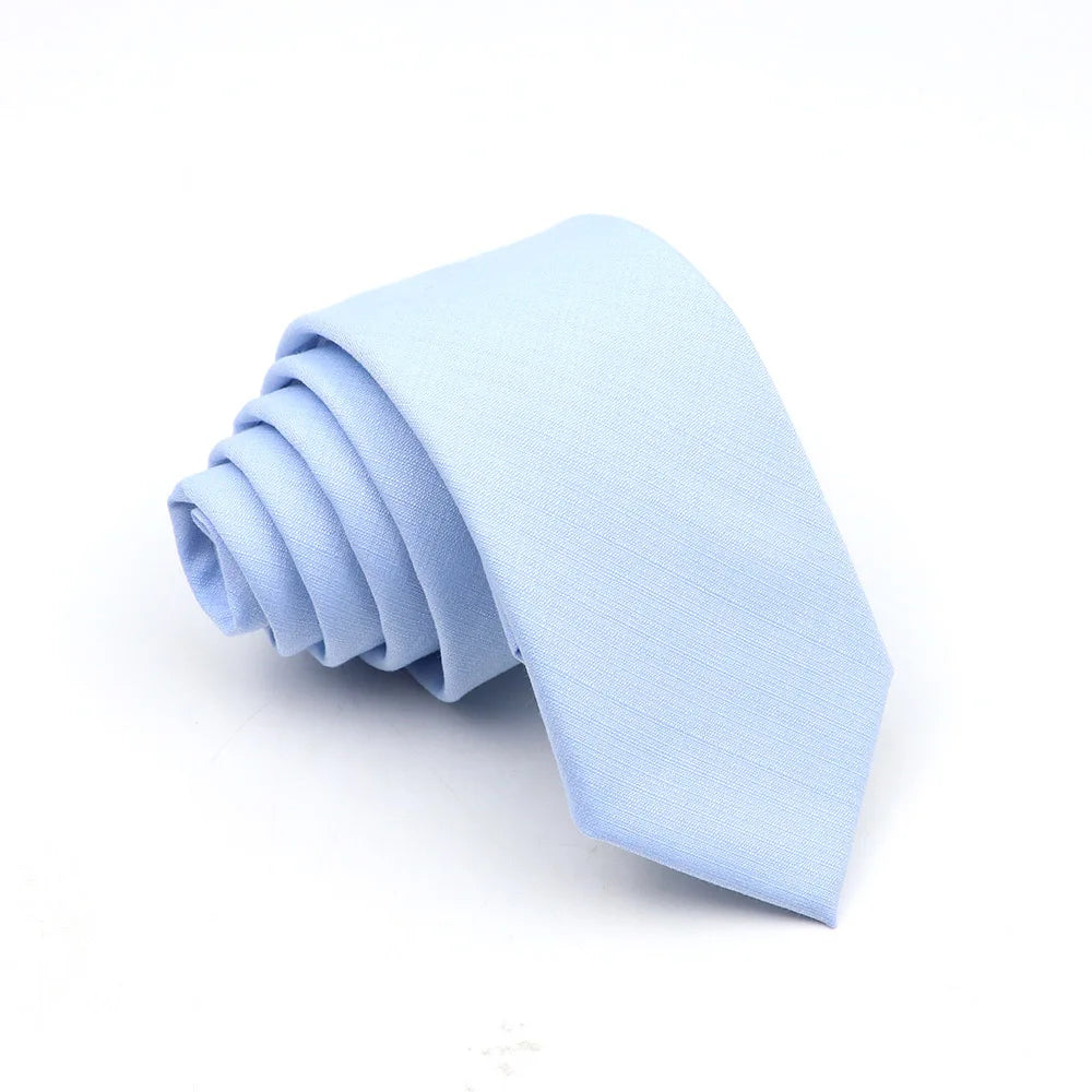 Light blue men's anti-wrinkle bamboo fiber tie folded neatly.