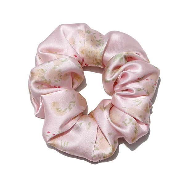 Pink silk hair scrunchies with a delicate floral pattern