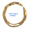 A circular arrangement of gold-plated hematite round cube beads for DIY jewelry.