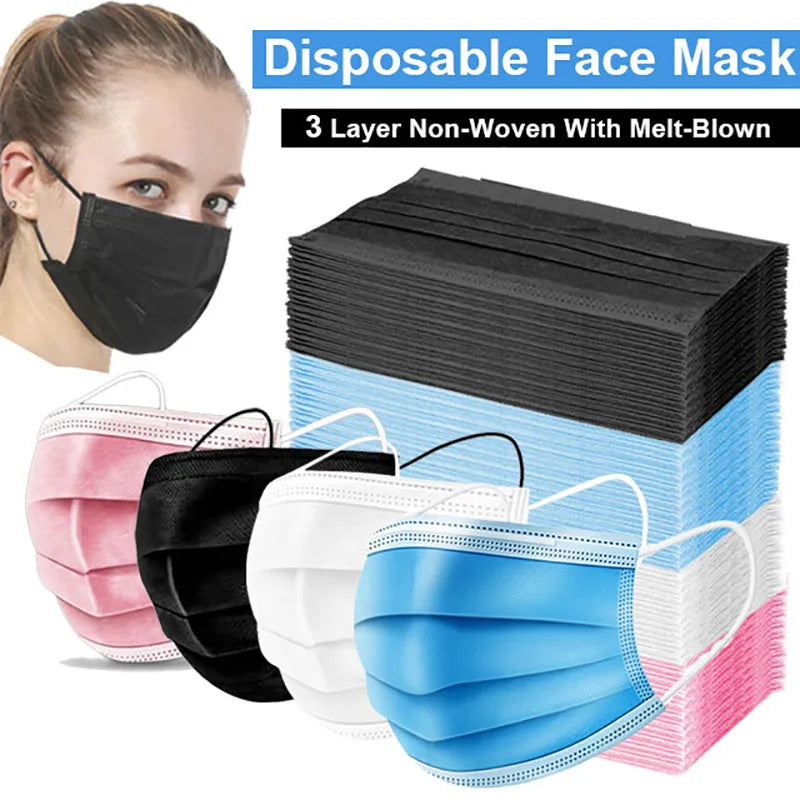 A collection of black, white, and blue disposable face masks stacked in a box.