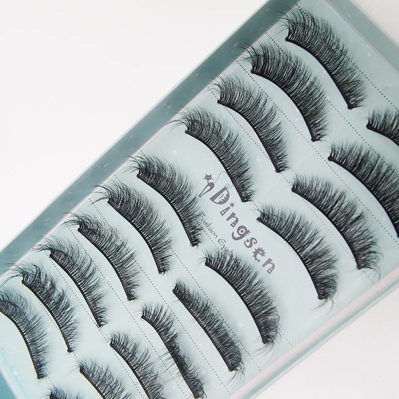 A display of black mink false eyelashes on a clear plastic tray.