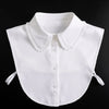 White blouse with a false collar and detachable neckline shown against a black background.