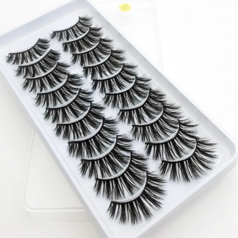 A tray of dramatic mink false eyelashes with varying lengths and styles displayed on a white background.