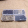 Three clear plastic containers hold various strands of metal hair clips in black and gold colors.