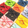 A collection of colorful bow ties and cufflinks arranged on a white background.