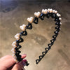Black elastic hair hoops adorned with pearl and rhinestone embellishments