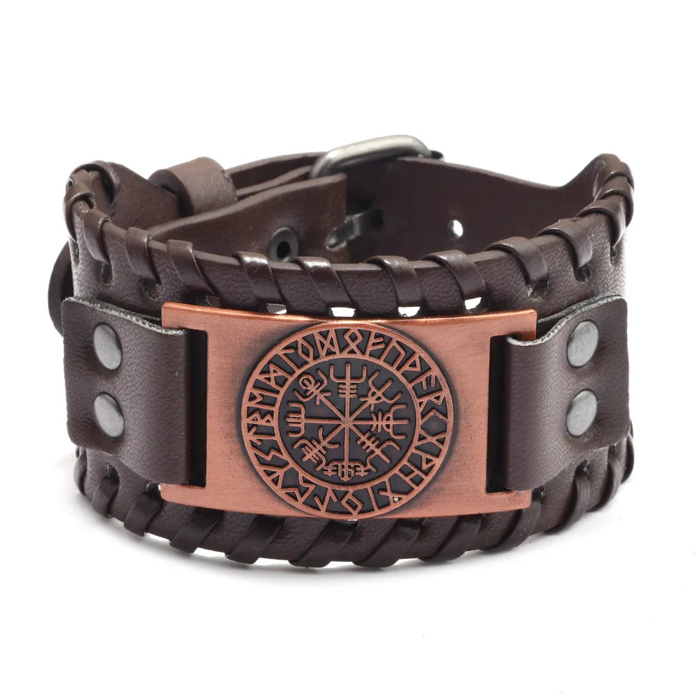 A dark brown leather bracelet featuring an engraved compass design and a bronze accent plate.