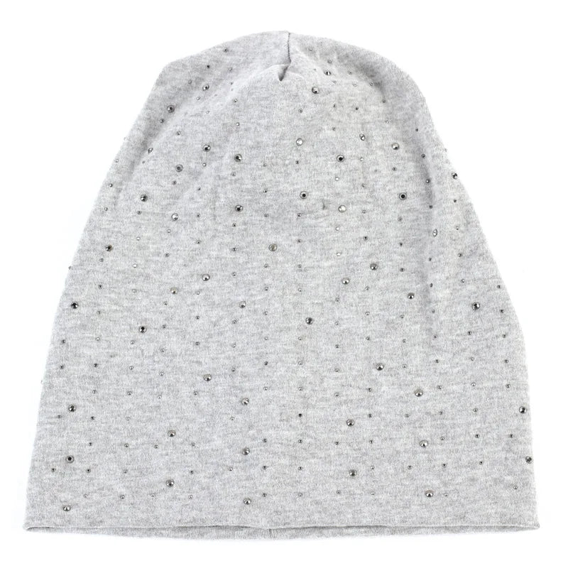 A light gray beanie hat adorned with small silver rhinestones.