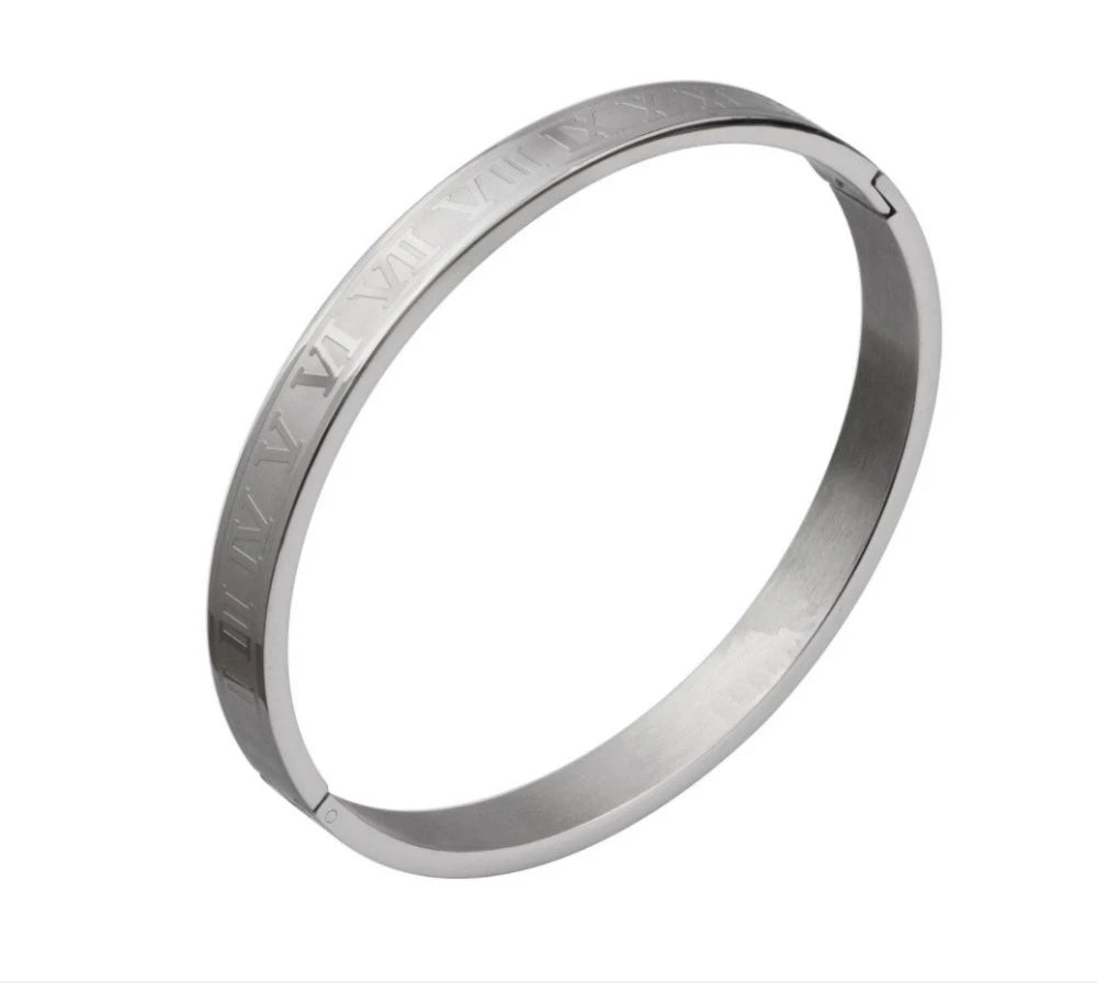 A silver stainless steel bracelet featuring Roman numerals engraved on the surface.