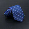 A dark blue striped necktie folded and displayed against a black background.